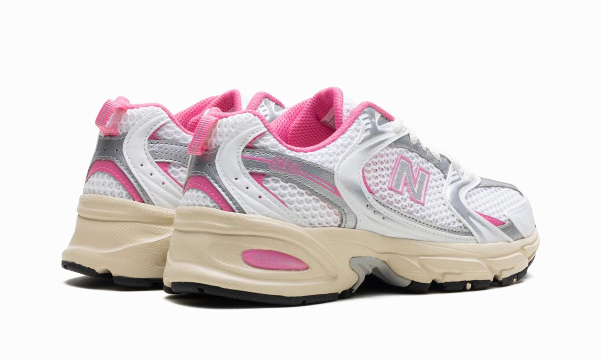 530 "White Pink Vintage" running in a gondola station area shoes beachgoers' shoes