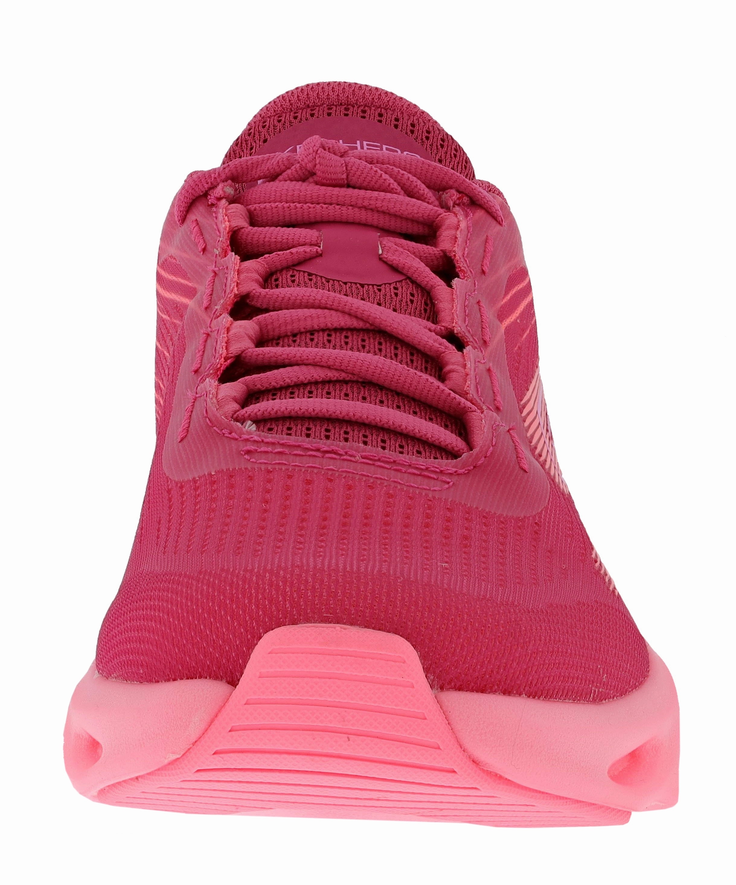 Skechers Women's Go Run Swirl Tech Speed- Ultimate Stride Running Shoes Lace Lock Technology running in a soccer field area shoes