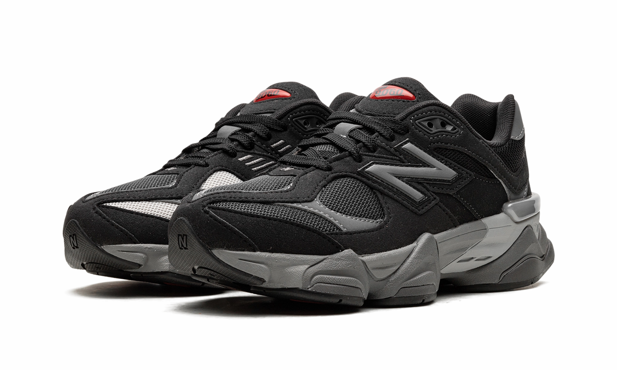 9060 Big Kid "Black Castlerock" running in a kelp forest area shoes