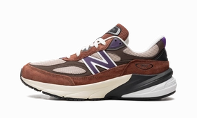 990v6 "Made in USA - Rich Oak / Cosmic Grape" running in a stadium running headbands