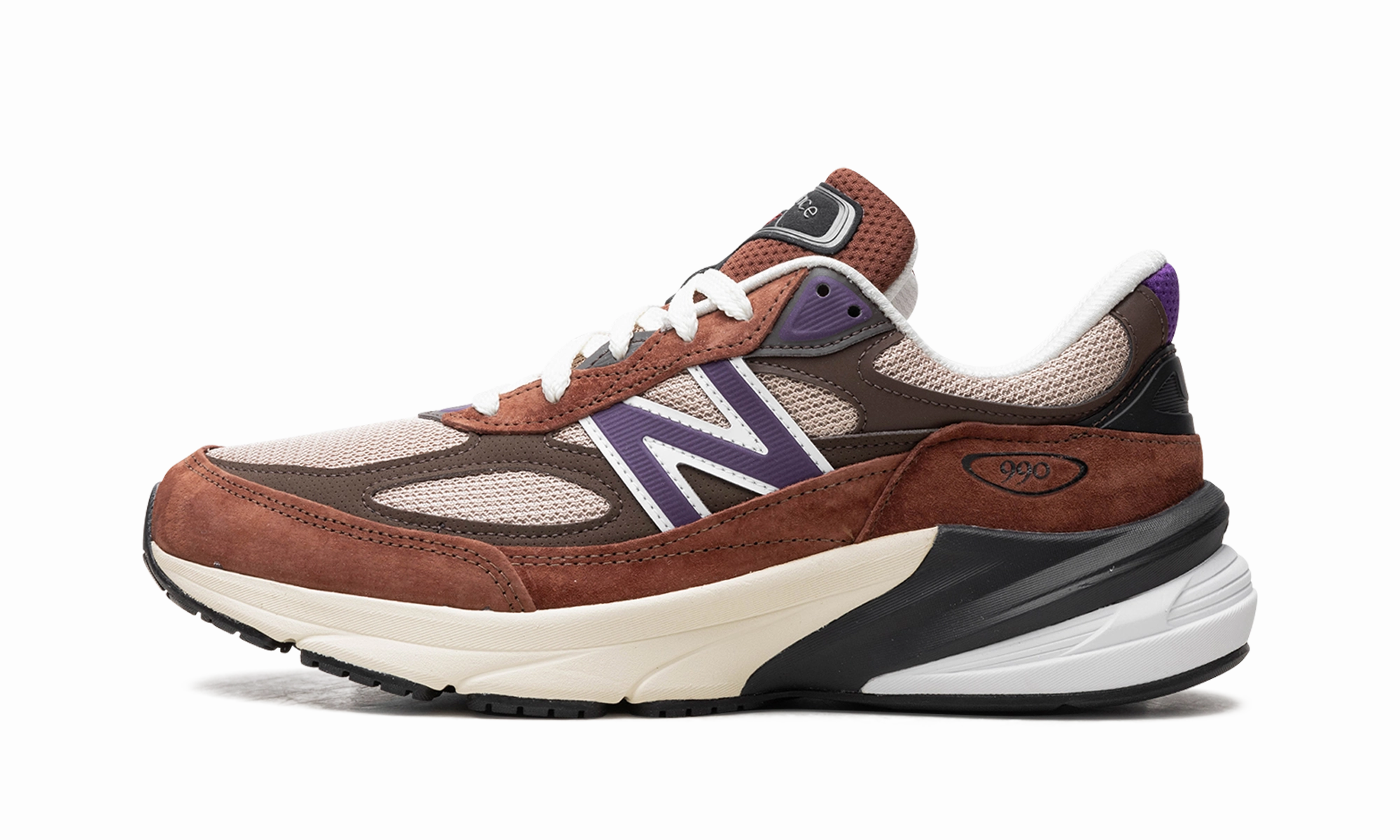 990v6 "Made in USA - Rich Oak / Cosmic Grape" running in a stadium running headbands